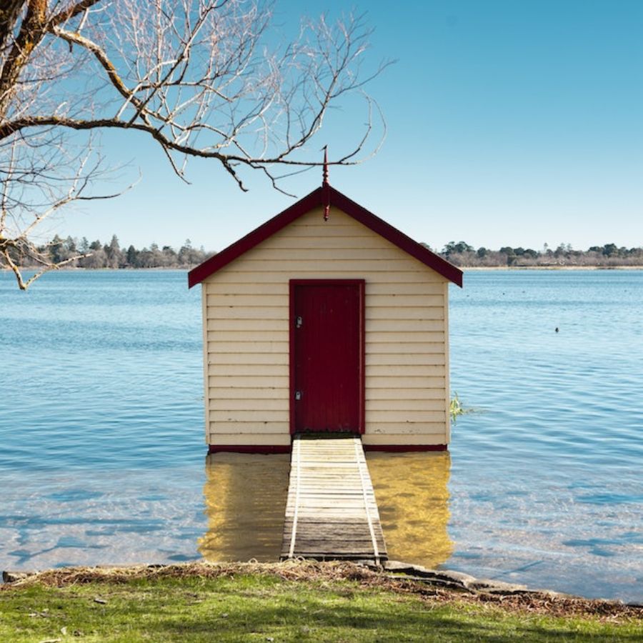 a shed built on the shores of a lake