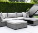Modern outdoor sectional sofa with visible lift-top storage compartments, showcasing sleek design and smart cushion storage solutions in a stylish patio setting.