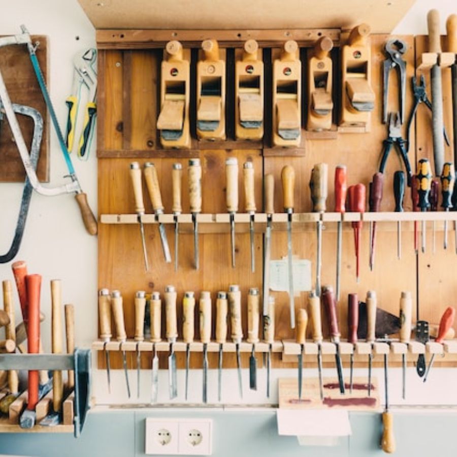 well organized tools on a shed wall