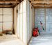 Split-screen image showing the interior of a shed with insulated (cozy, warm) and uninsulated (cold, damp) sections, emphasizing the benefits of proper insulation.