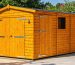 Illustration of a wooden shed equipped with high-security features, including a strong padlock, door bar lock system, motion sensor lights, and reinforced hinges, depicting a safe and secure outdoor storage solution.