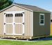 A shed supported by heat-treated skids with visible ground preparation layers like gravel and moisture barrier, demonstrating enhanced durability and protection against decay and insects.