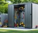 A modern large vertical storage shed in a landscaped backyard, demonstrating efficient organization with garden tools and equipment neatly arranged around it.