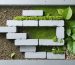 Conceptual illustration of an eco-friendly concrete block shed foundation, depicting layers of gravel, concrete blocks, and support beams with visual elements of leaves and recycling symbols to emphasize sustainability.