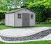 A beautifully constructed backyard shed resting on a detailed paver foundation amidst a lush garden background. The image illustrates the interlocking paver system, highlighting its eco-friendly and durable construction along with a cross-sectional view of the layered foundation.
