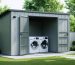 Modern outdoor laundry shed with front-loading washer and dryer, surrounded by a paved pathway, plants, and a well-manicured lawn.