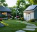 A backyard scene featuring a solar-powered shed with roof-mounted panels, LED-lit garden path, and a small wind turbine, depicting sustainable energy use in an outdoor space.