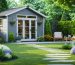 A 3D rendering of a backyard workshop shed with large windows and a gabled roof, surrounded by a well-manicured garden and path, illustrating an ideal combination of functional and aesthetic design.