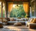 "Three-season porch transformed with cushions, curtains, and rugs, bathed in warm sunlight for a cozy, year-round haven."