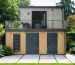 "A modern two-story storage shed in a beautifully landscaped backyard, emphasizing its dual functionality and aesthetic appeal."