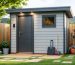 Modern garden shed exterior with a small outdoor security camera above the door, a keyless smart deadbolt, and a discreet climate sensor, shot at eye level with soft daylight and a blurred garden background.