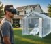 Person wearing a VR headset in a suburban backyard viewing a translucent life-size 3D shed overlay with open doors and a lawn mower inside, with house, garden beds, and trees softly blurred under warm evening light