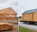 Rural property scene showing a framed on-site barn construction area next to a prefab barn section delivered on a flatbed trailer.
