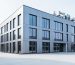 “Modern building facade with insulated wall panel details under soft daylight, suggesting improved energy efficiency and durable construction.”