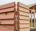 Close-up comparison of tongue-and-groove and V-groove wood shed wall panels, showing the interlocking overlap versus the V-shaped channels.